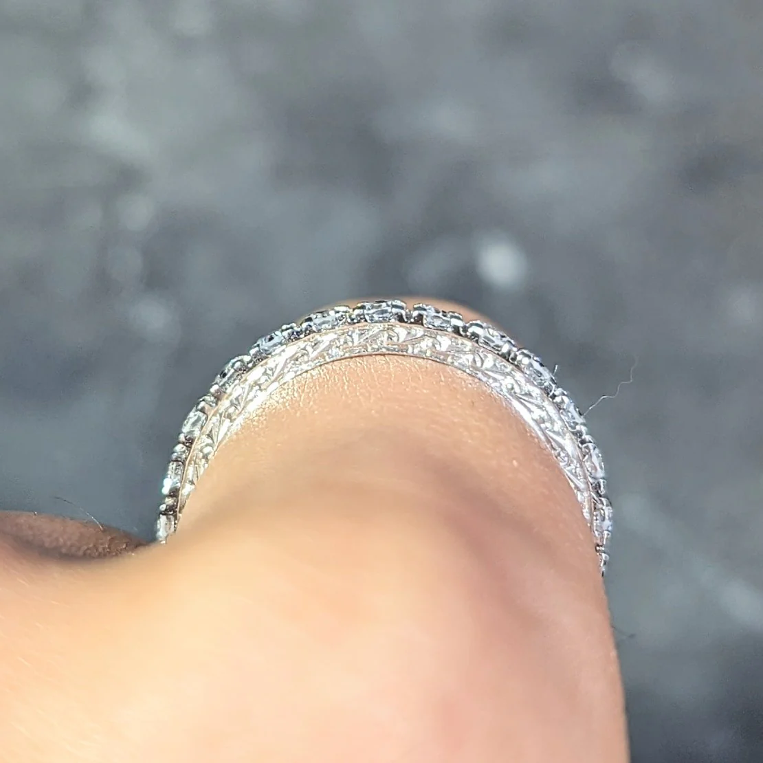 Contemporary 0.72 CTW Diamond Platinum Scrolling Dollar Sign Eternity Band Ring - Image 10