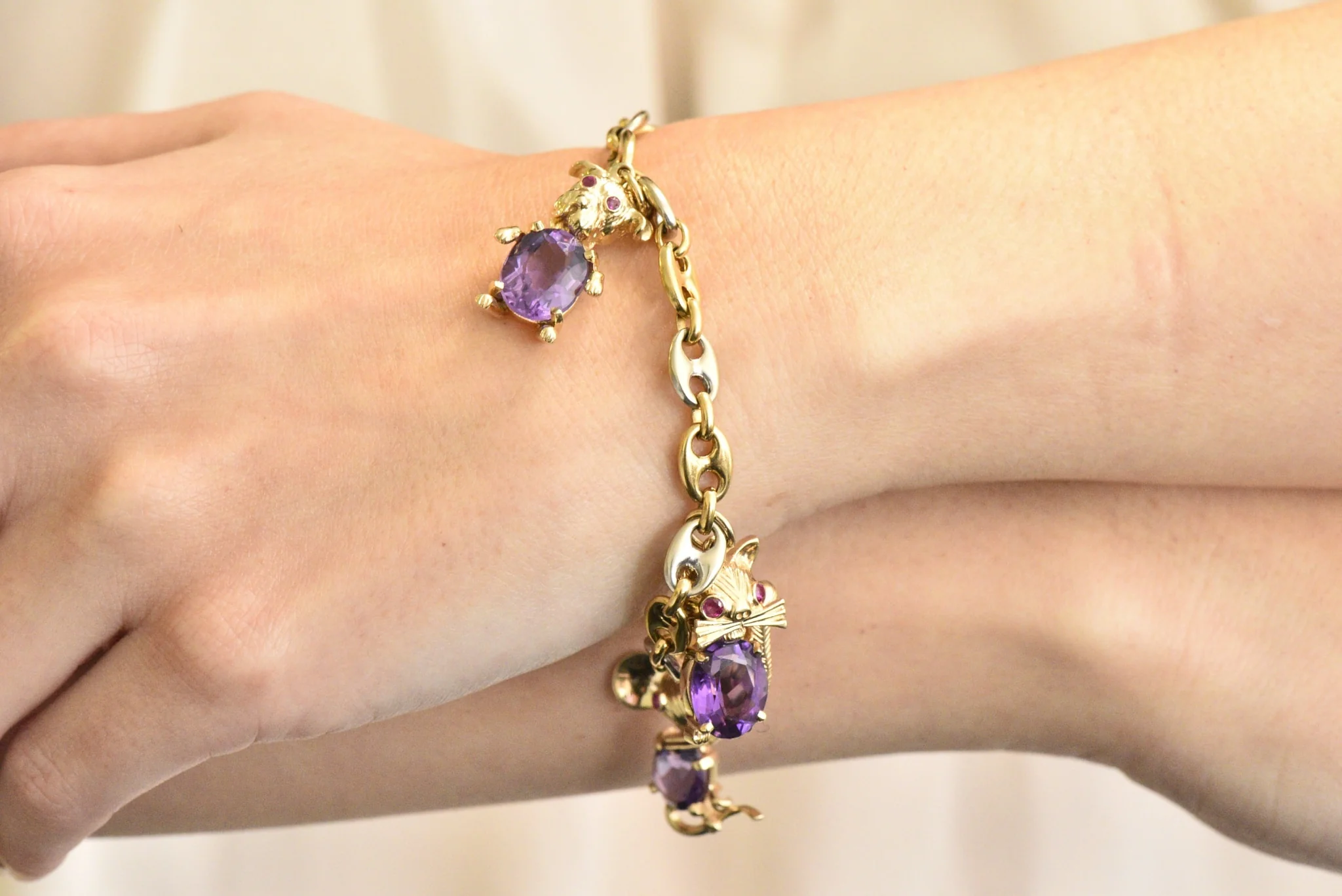 Contemporary 10.70 CTW Amethyst Two-Tone Gold Animal Charm Bracelet - Image 8
